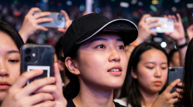 Woman watching concert - being in the moment